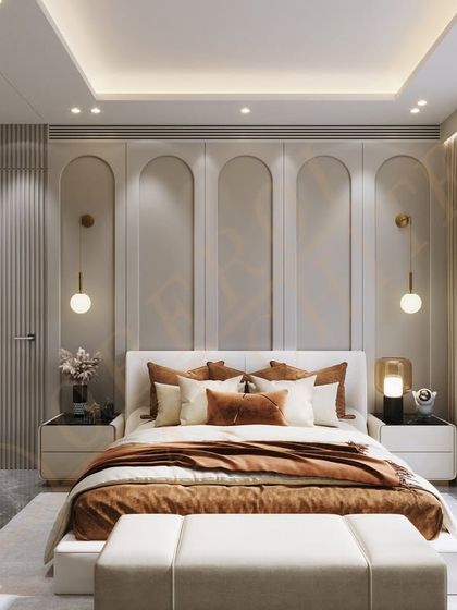 This modern bedroom features an arched, upholstered headboard wall and a warm, earthy color palette. The design feels contemporary yet soft and inviting.