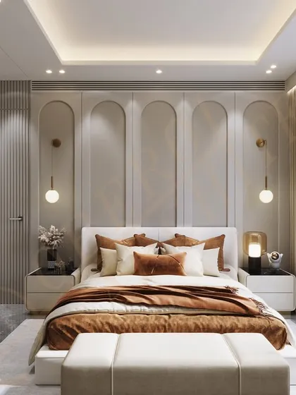 A bedroom design featuring an arched wall motif and warm, earthy tones, creating a cozy and sophisticated atmosphere.