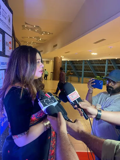 Sharing my thoughts with the media after a performance. It is always a pleasure to talk about my passion for music and the stories behind my songs.