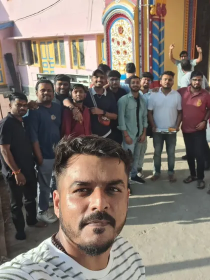 A group selfie outside a local temple. We love exploring the culture of the places we visit.