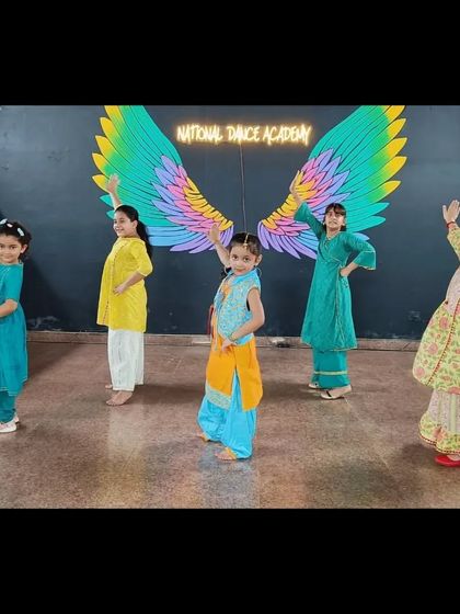 Striking a pose before the performance begins. We teach both the dance moves and the stage presence needed to be a confident performer.