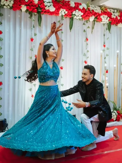 Engagements are about celebration. I focus on capturing the energy and joy, like this beautiful dance performance at Apurva and Kunal's ceremony in Thane, where their happiness is absolutely infectious.