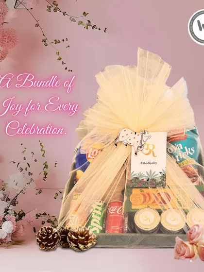 A bundle of joy for any celebration, this hamper is elegantly wrapped in yellow netting. It's packed with snacks, drinks, and other surprises, making it a versatile gift for a baby shower, birthday, or thank you gesture.