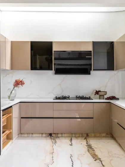 The kitchen is the heart of the home, and in the Avani Residence, we designed it to be bright, airy, and seamlessly connected to the dining area. High-gloss finishes, a marble backsplash, and a skylight ensure the space is always filled with light and positive energy.