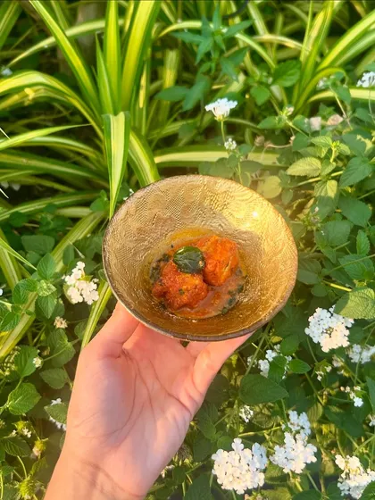 Gunpowder Cottage Cheese served in a Rasam Broth, a South Indian-inspired appetizer with a spicy kick.