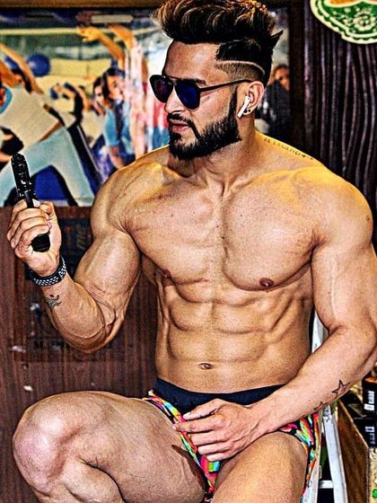 A close-up shot displaying extreme conditioning. The separation in the chest and abs is a result of a meticulous diet and training plan.