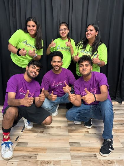 The full "Lazy Group" with their instructors. This photo captures the fun and collaborative spirit of our showcase preparations.