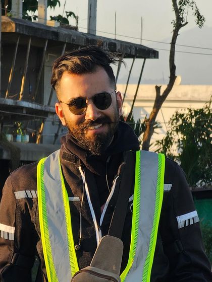 A smile on the road. This shot captures the positive and real energy I bring to travel and lifestyle photoshoots, making the content feel genuine and relatable.