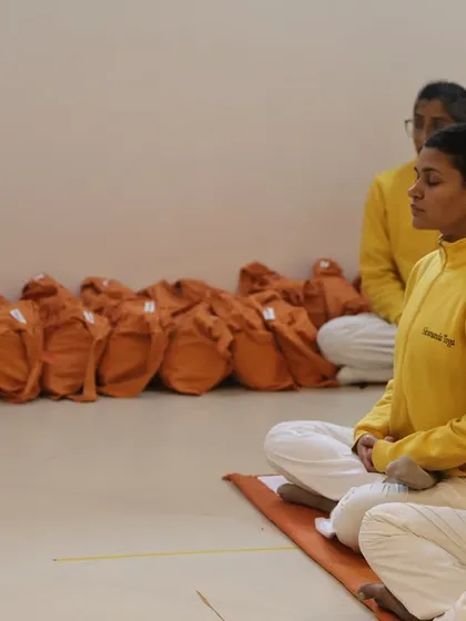 The initiation ceremony (Diksha) for the Yoga Teachers' Training Course. This is a sacred moment where the student is formally welcomed into the Guru-Sishya tradition, or lineage of teachers.