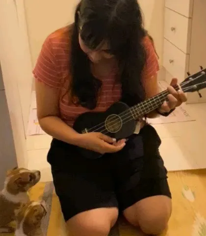 Another shot of me playing the ukulele for the foster puppies. Music can be a wonderful enrichment activity for dogs.