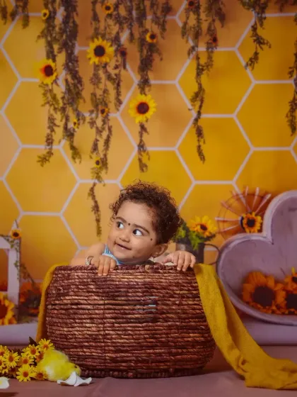 A sweet, shy smile from our little honey bee.