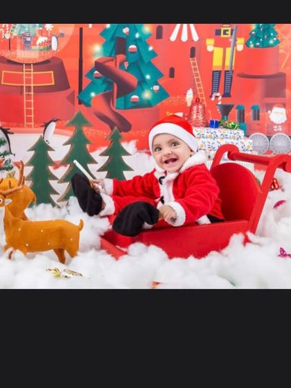 The happiest little Santa's helper, enjoying a sleigh ride through a winter wonderland.