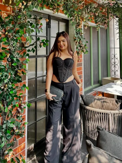 Posing against the beautiful floral brick wall at Sunday House India. I always find the most Instagrammable spots in a venue to create content that makes people want to visit.