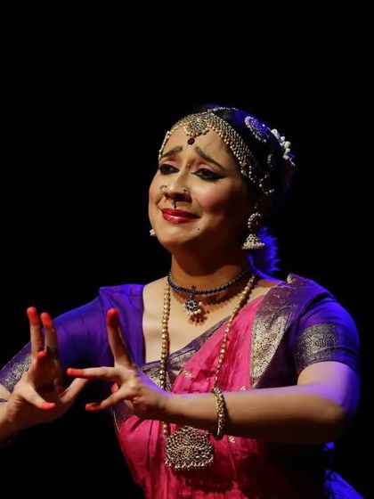 A moment of serene storytelling on stage. The ability to connect with the audience and evoke 'rasa' or aesthetic emotion is the hallmark of a mature artist.