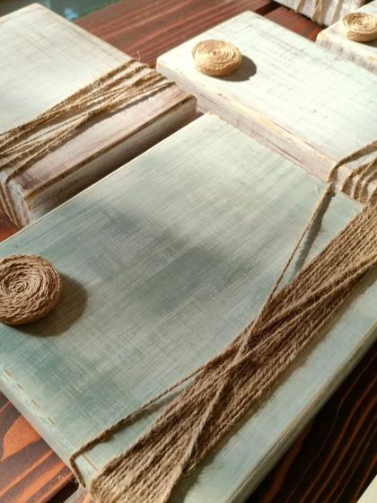 Our photo blocks in the making. Each one is hand-sanded and painted to create a unique, rustic finish, ready to hold your precious moments.