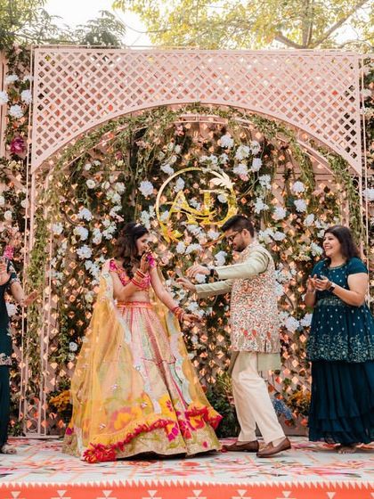 The couple joining in with the family for a group dance, creating a perfect, happy memory.