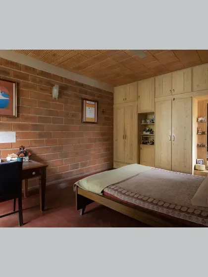 A duplicate of the first bedroom, showing the simple, clean lines of the furniture.
