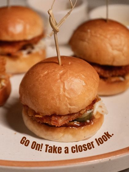 Go on, take a closer look. The perfect little bite of our fried chicken bun, with all its layers of texture and flavour.