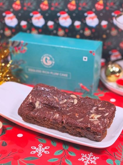 Our Eggless Rich Plum Cake is a holiday essential. It's packed with soaked fruits and spices, making it the perfect dense and flavorful Christmas treat.
