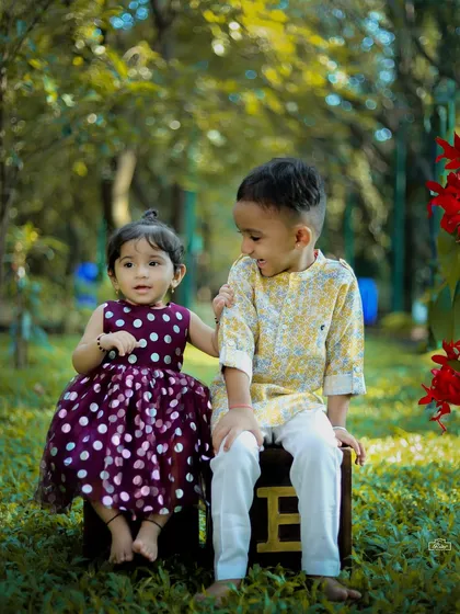 The sweet bond between siblings captured during a relaxed outdoor photoshoot in a Bangalore park. We love creating a fun atmosphere where kids can be themselves, resulting in genuine smiles and candid family portraits.