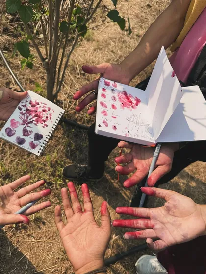 Sometimes art gets messy! Using natural pigments from flowers to create colors in my sketchbook.
