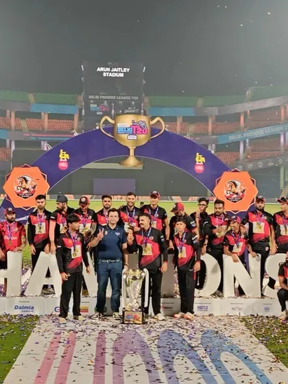 The team celebrating on the champions' podium. An unforgettable night.