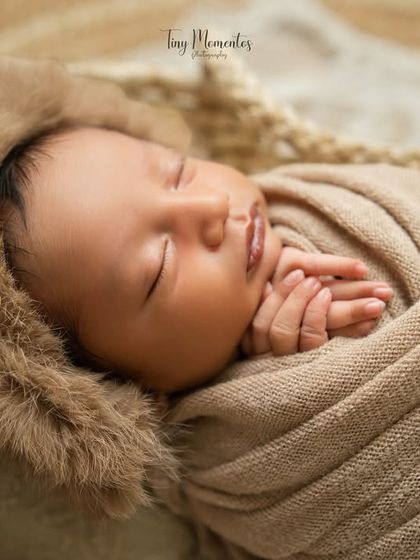 A side profile of the sleeping baby, showing the gentle curve of their lips and nose. Every angle offers a new and beautiful perspective.