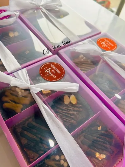 A closer look at my brownie boxes, tied with a ribbon and a 'Homemade with Love' sticker. It's the little details that make a gift special.