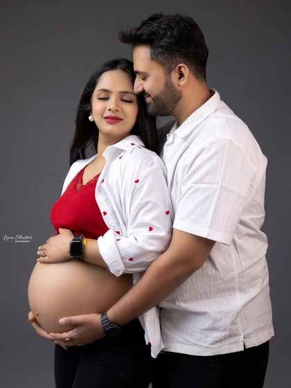 A sweet and intimate moment between the expecting parents. The casual, modern styling and the genuine emotion make this a beautiful and authentic portrait.