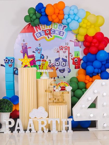 An educational and colorful Numberblocks themed party. This unique setup is perfect for curious little minds, featuring all their favorite characters, a vibrant balloon arch, and a light-up number to celebrate turning four.