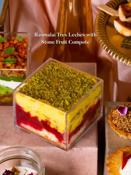 My Rasmalai Tres Leches with Stone Fruit Compote. This fusion dessert features layers of sponge cake soaked in three milks, rasmalai flavor, and a bright stone fruit compote, topped with pistachio dust.