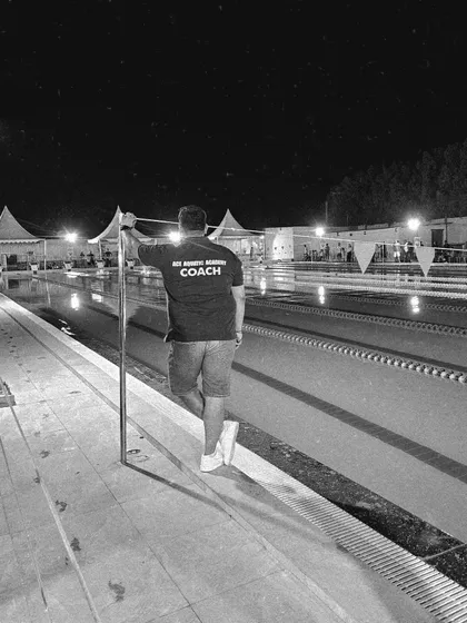 A quiet moment of reflection by the pool after a long day of coaching. My vision is to strive for greatness and build a legacy of success.