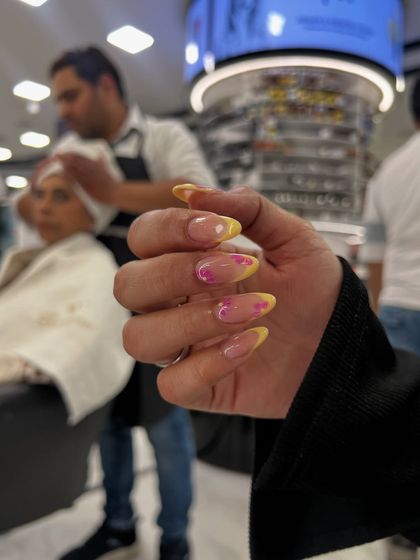 A vibrant and summery airbrush ombré design, blending yellow and pink for a fun, eye-catching look.