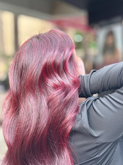 A bold and beautiful global plum red with highlights. This color is rich, vibrant, and makes a definite statement.