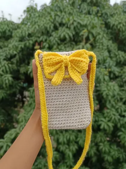The same bow-front phone sling bag, this time in a cheerful yellow and beige combination. I can create these in any color palette.