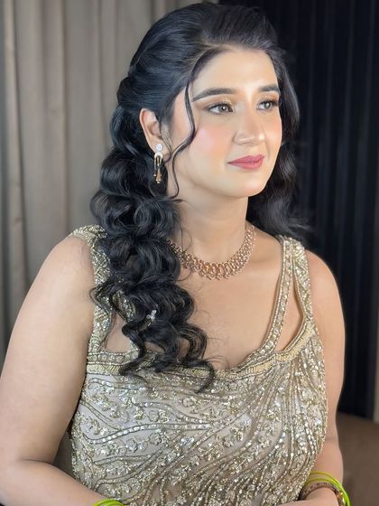 A side profile showing her romantic, curly hairstyle.