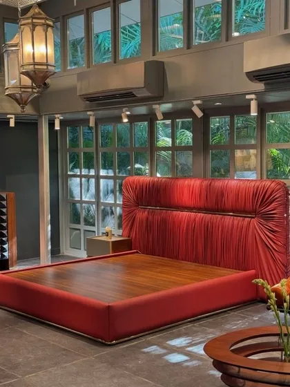 Our unique bed design featuring sleek metal detailing and a stylish, intentionally wrinkled look in a bold red fabric. This piece brings a perfect balance of relaxed sophistication and modern elegance to any bedroom.