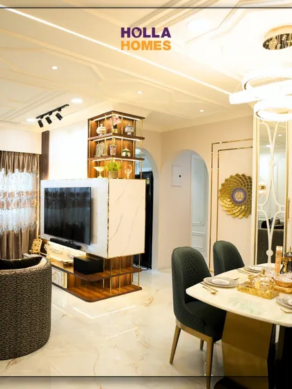 This angle shows the open layout of the Parisian-themed home, with the dining area flowing seamlessly into the living space, unified by elegant design choices.