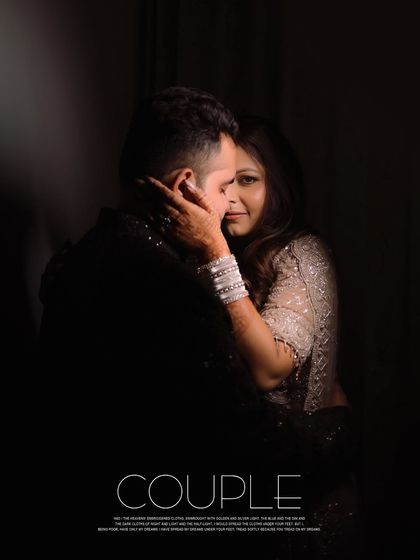 A moody and intimate portrait of the couple, with the bride looking towards the camera. The use of shadow creates a very personal and cinematic feel.