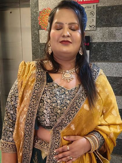 The full look, showing how the makeup ties together with her traditional attire for a cohesive and stunning appearance.