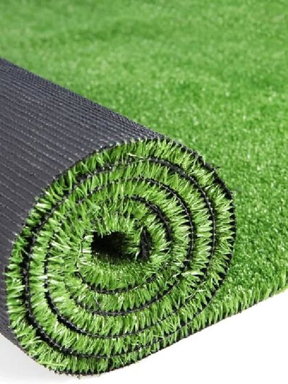 A standard roll of artificial grass, showing the dark, durable backing and the green turf. All my products are UV protected to resist fading in the sun.