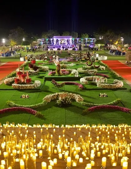 An overview of a heavenly reception layout. I designed the space with floral-patterned lawns and pathways lit by thousands of candles, creating a magical, starlit garden.