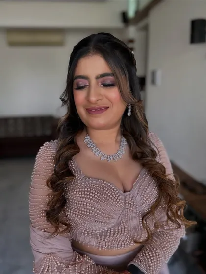 A close-up of a soft, romantic makeup look. The pink eyeshadow and nude lip are a classic combination that suits any occasion.