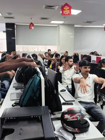 A moment of collective stretching during a busy workday. These simple, guided movements help to break the monotony, increase blood flow, and provide an instant mental and physical reset for your employees, boosting afternoon productivity.