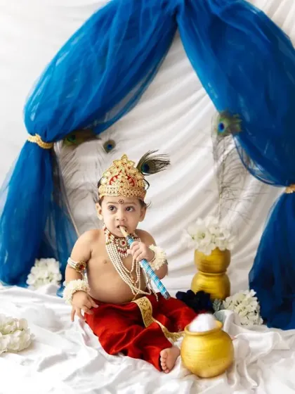 A classic Kanha pose with the flute. This little one looks so peaceful and sweet in his festive attire.