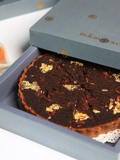 Indulge in our exclusive dessert gift boxes, crafted to elevate your Diwali celebrations. This doda burfi treacle tart, elegantly packaged, makes for an ideal festive gift.