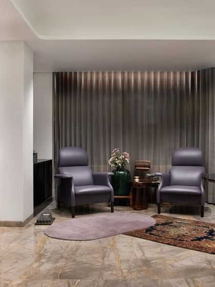 By transforming a 3BHK into a 2BHK, I carved out this exquisite bar and lounge space. It's a sophisticated haven designed for entertainment and relaxation, where plush seating and bespoke lighting create an atmosphere of celebration.