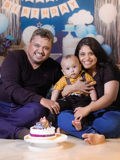 The perfect family photo to wrap up a fun cake smash session. It's a beautiful memory of celebrating the first birthday together.