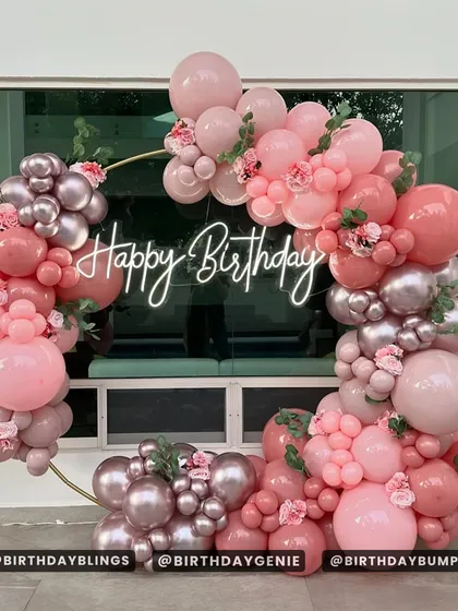 An elegant circular balloon arch in dusty rose, mauve, and silver. This sophisticated color palette is perfect for bridal showers, milestone birthdays, or any chic event.