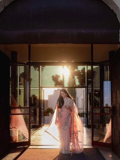The bride, Shikha, glowing in the golden hour, wearing a contemporary drape by Anamika Khanna that perfectly captured the fusion of Indian legacy and modern elegance.